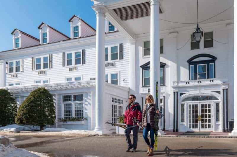 Couple walking out with skis